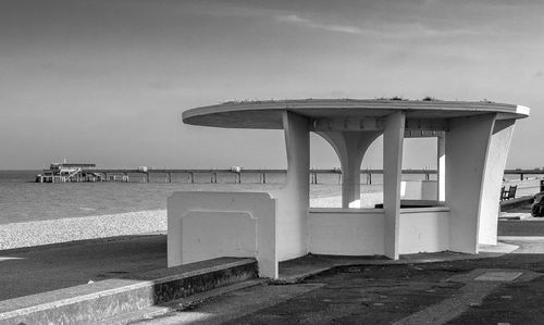 Built structure on beach against sky