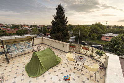 High angle view of trees and buildings against sky