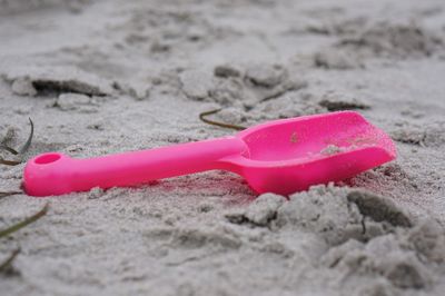 Close-up of pink and red sand on beach