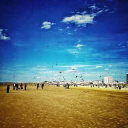 Scenic view of beach against blue sky