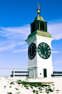 Low angle view of clock tower against sky