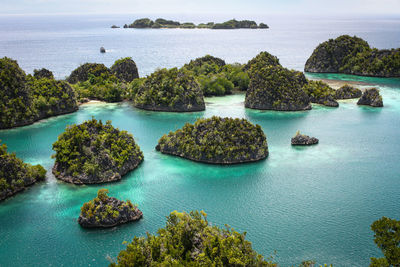 Scenic view of sea against sky at piaynemo raja ampat