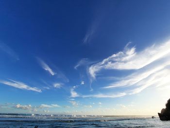 Scenic view of sea against blue sky