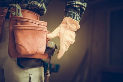 Midsection of manual worker standing in factory