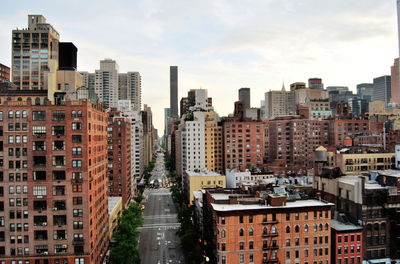 Buildings in city against sky