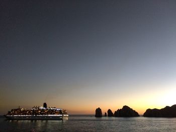 Scenic view of sea against clear sky during sunset