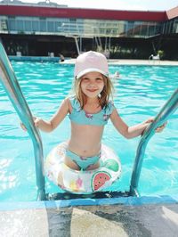 Little girl swimming in pool