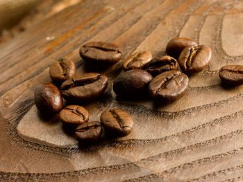 Close-up of coffee beans on table