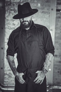 Portrait of man wearing hat standing outdoors