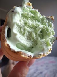 Close-up of hand holding ice cream