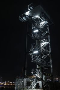 Low angle view of illuminated building at night