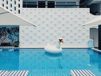 Swimming pool against built structure