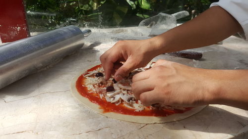 Midsection of man preparing food