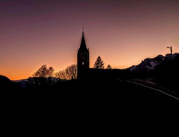 Silhouette of building at sunset