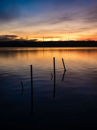 Scenic view of lake against sky during sunset