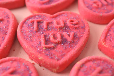 Pink valentine cookies with writing--true luv