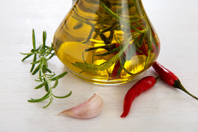 High angle view of oil in container on table