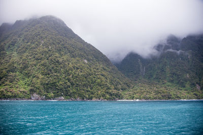 Scenic view of sea against mountain