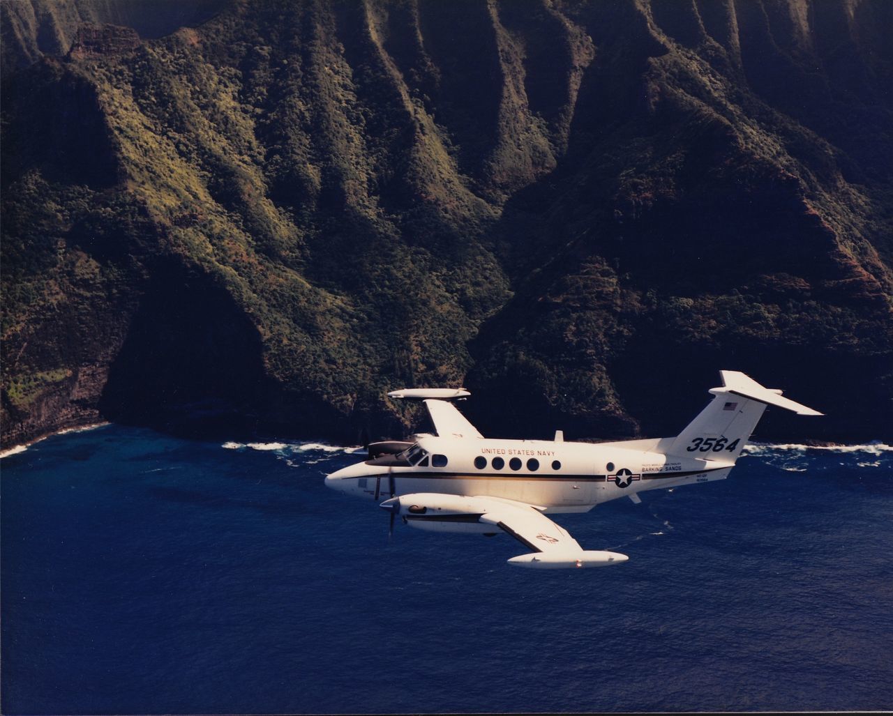 AIRPLANE FLYING OVER LAND