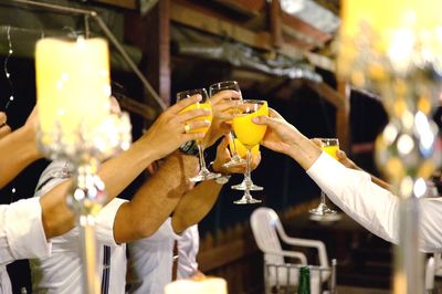 Friends toasting drinks at restaurant