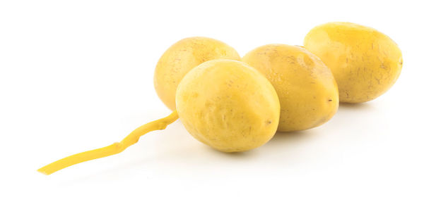 Close-up of fruits against white background