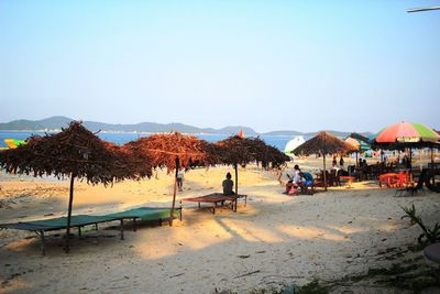 Scenic view of beach against blue sky