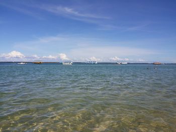 Scenic view of sea against blue sky