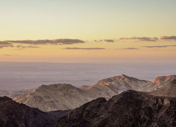 Scenic view of mountains against sky during sunset