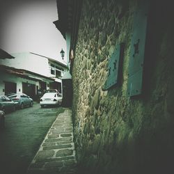 View of road along buildings