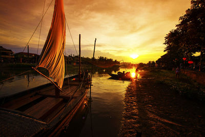 Boat in sea at sunset