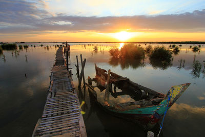 Scenic view  boat at salt field with sunrise