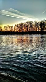 Scenic view of lake at sunset