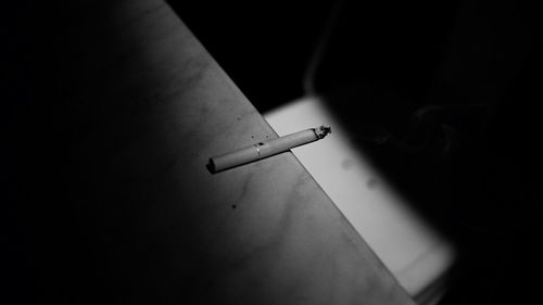 Close-up of cigarette on table