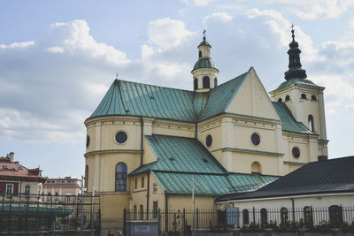 View of bell tower against cloudy sky