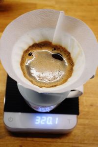 High angle view of coffee in cup on table