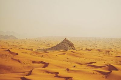 Scenic view of desert against clear sky