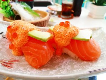 Close-up of fruits in plate on table