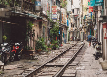 Railroad track amidst buildings in city