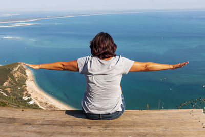 Rear view of woman looking at sea