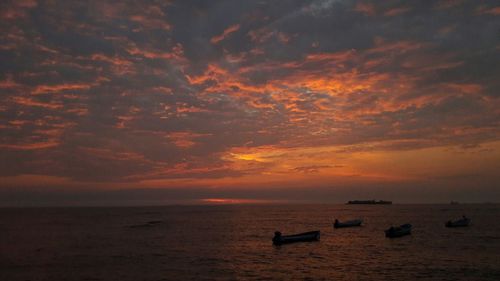 Scenic view of sea against dramatic sky