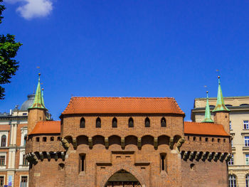 Low angle view of building against clear blue sky