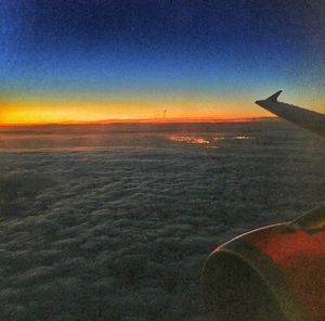 Aerial view of landscape against cloudy sky