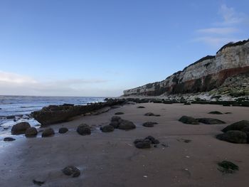 Surface level of beach against sky