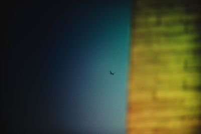 Low angle view of airplane flying in sky