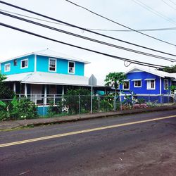 View of buildings against blue sky