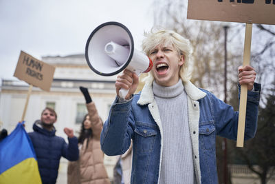 Activist talking on microphone during protest