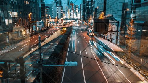 Light trails on city street and buildings at night