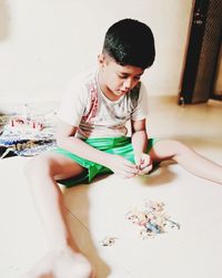 Girl playing on table at home