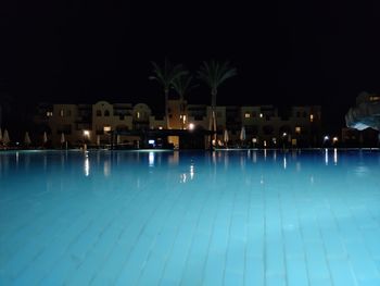 View of swimming pool at night