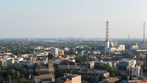 High angle view of buildings in city against sky